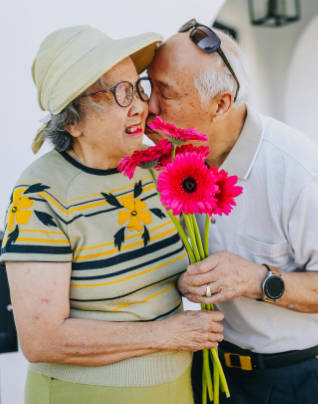 Elderly couple kissing